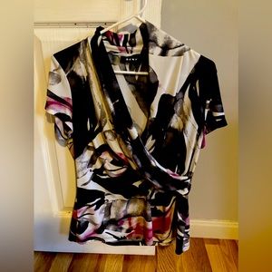 Calvin Klein fancy top with plunging neckline.